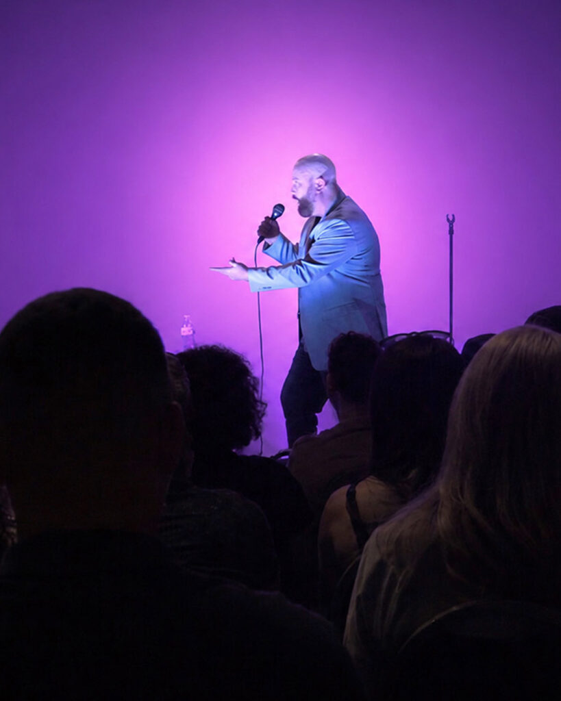 Tim Palmer under a purple spotlight