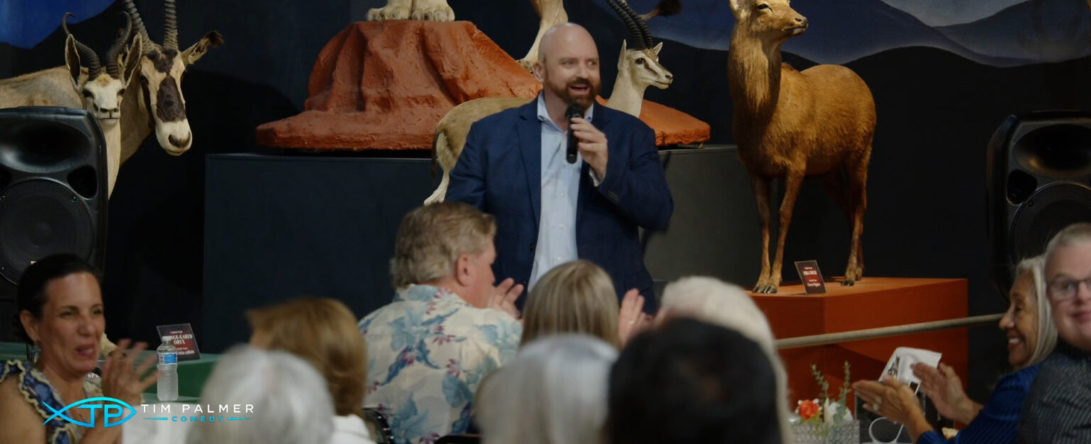 Tim Palmer performing for a gala audience at a science museum